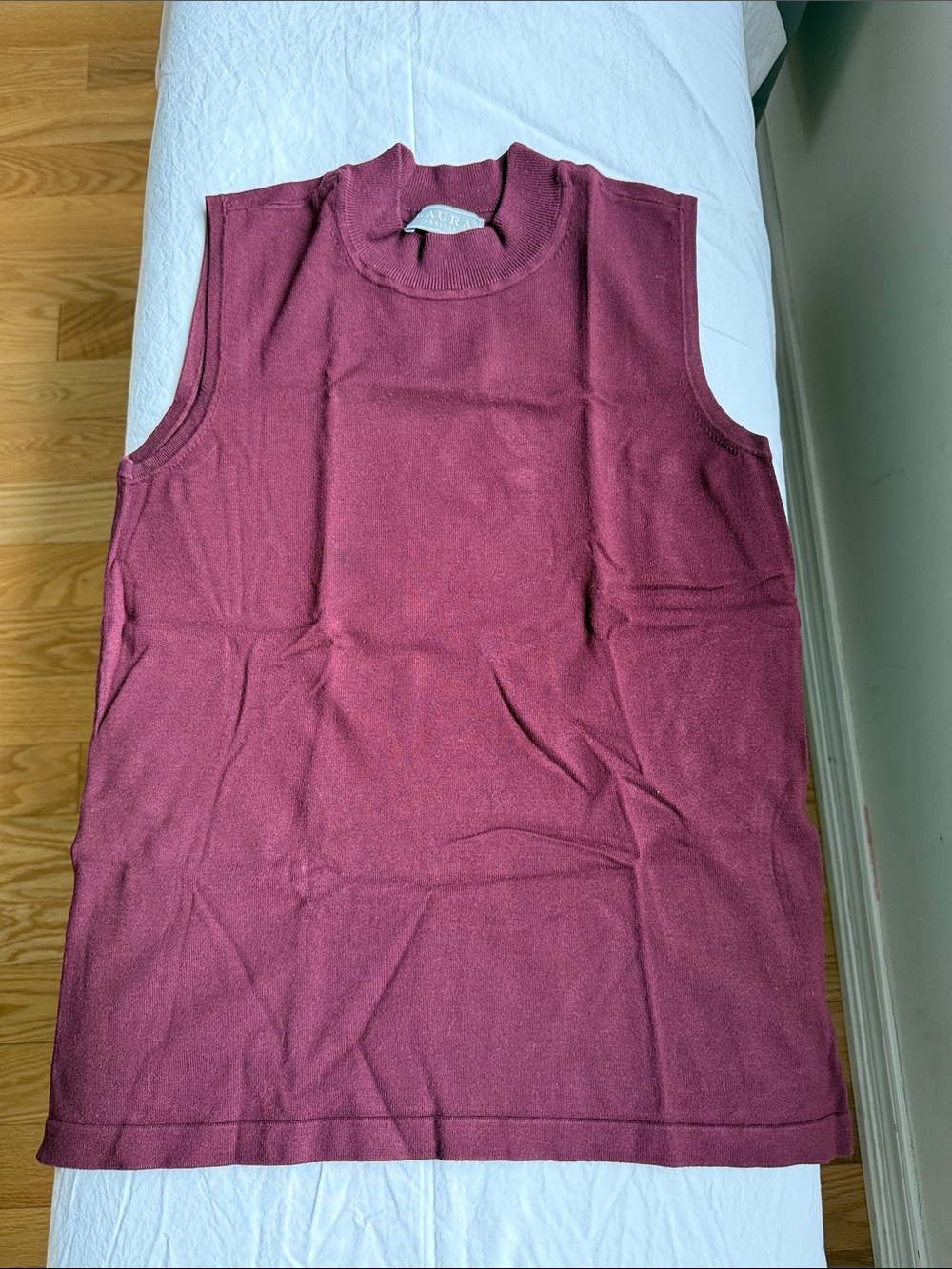 Laura sleeveless, turtleneck.